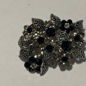 Elegant Black and Silver Floral Brooch